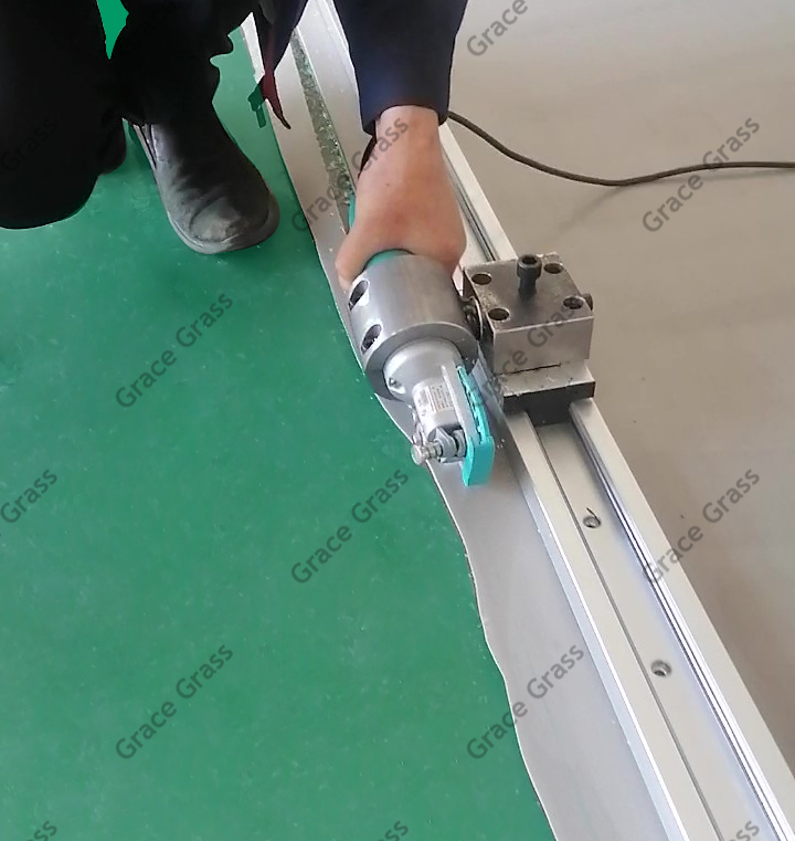 Our custom track system with a mounted electric rotary shear.